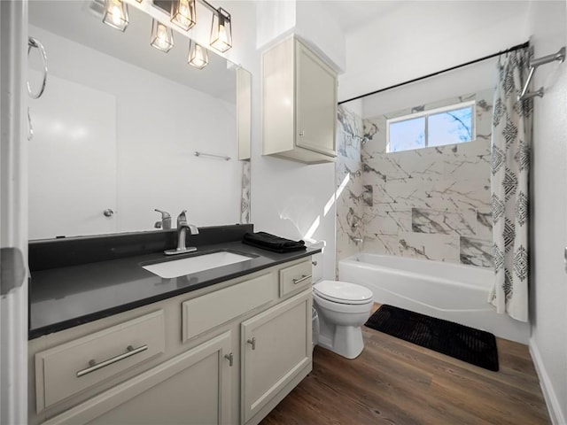 full bathroom with wood-type flooring, toilet, shower / bathtub combination with curtain, and vanity