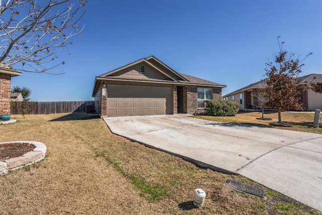 ranch-style house featuring a garage and a front lawn