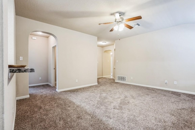 spare room with carpet floors and ceiling fan