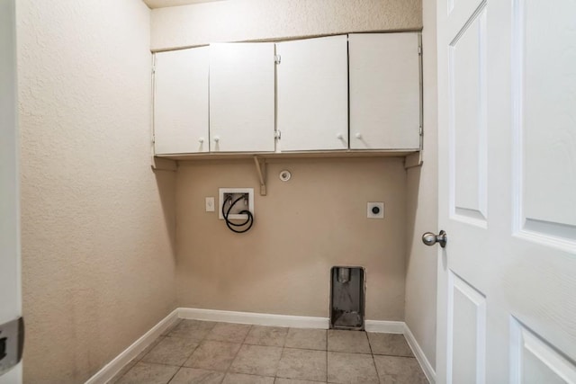 laundry room with electric dryer hookup, hookup for a washing machine, cabinets, and gas dryer hookup