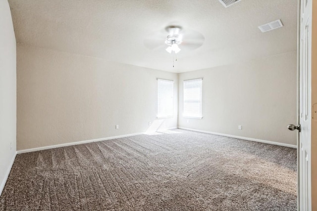 empty room featuring carpet flooring and ceiling fan