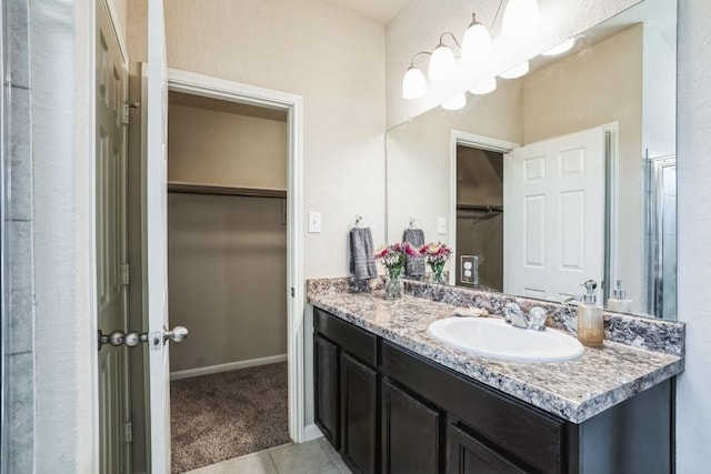 bathroom with tile patterned flooring and vanity