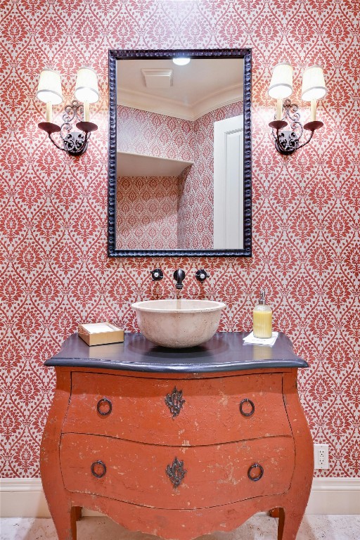 bathroom featuring vanity and ornamental molding