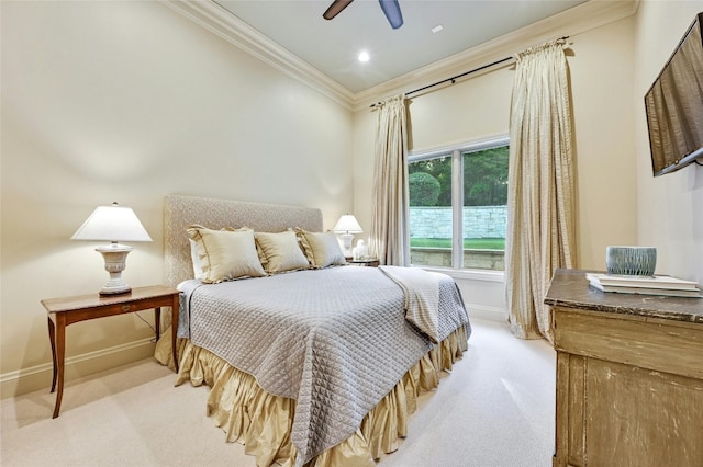 bedroom with crown molding, light carpet, and ceiling fan