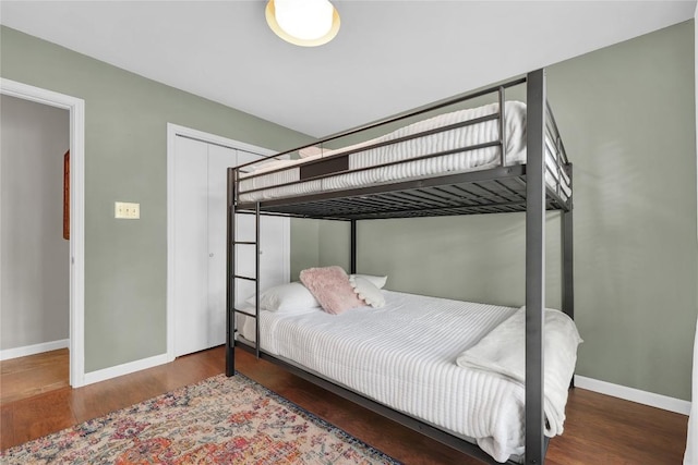 bedroom with hardwood / wood-style flooring