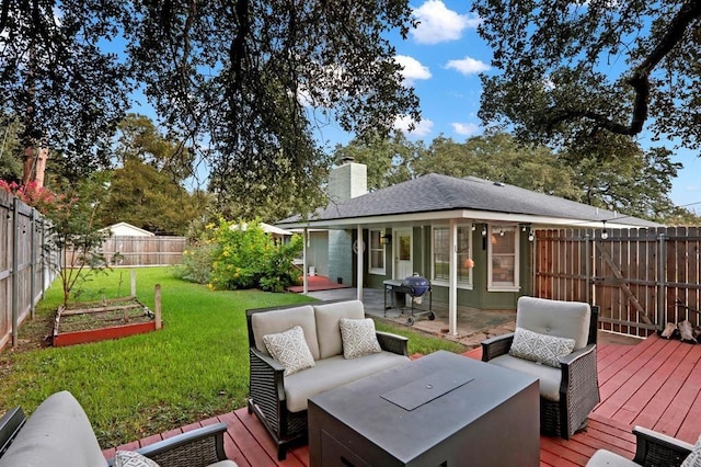 wooden terrace with an outdoor living space, a yard, and grilling area