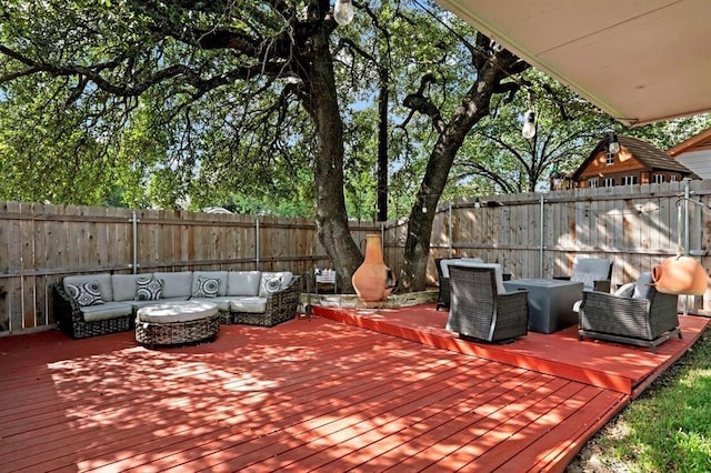 wooden deck with outdoor lounge area