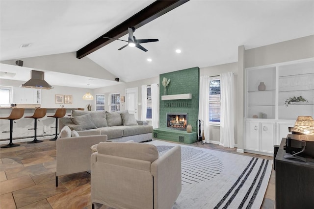 living room featuring a brick fireplace, built in features, a wealth of natural light, and lofted ceiling with beams