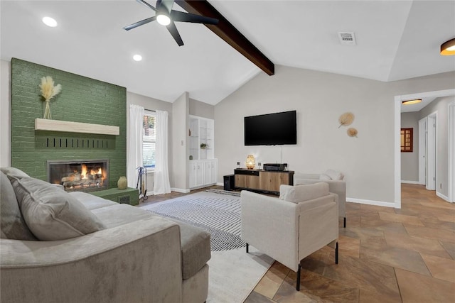 living room featuring ceiling fan, a fireplace, and vaulted ceiling with beams