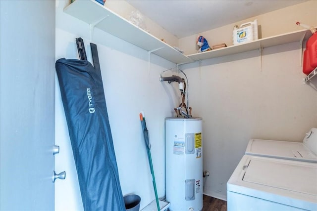 laundry area featuring water heater, dark wood-type flooring, and independent washer and dryer