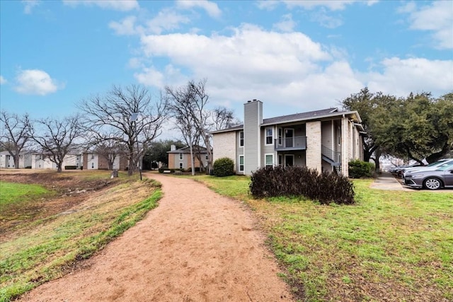 view of property exterior featuring a yard