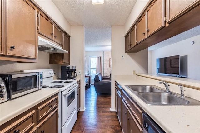 kitchen featuring sink, dark wood-type flooring, dishwasher, white electric range oven, and a textured ceiling