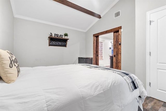 bedroom with hardwood / wood-style floors and vaulted ceiling with beams