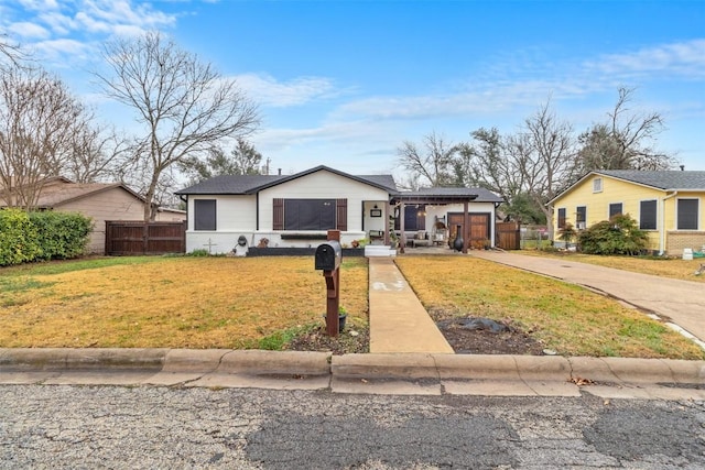 single story home with a garage and a front yard