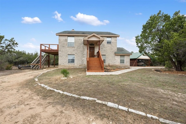 15101 Foy Dr, Austin, TX 78734 - view of front facade with stairs, stone siding, and a wooden deck