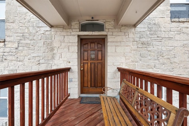 15101 Foy Dr, Austin, TX 78734 - view of exterior entry featuring stone siding and covered porch