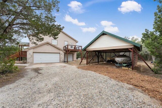 15101 Foy Dr, Austin, TX 78734 - view of front of house with stairway and gravel driveway