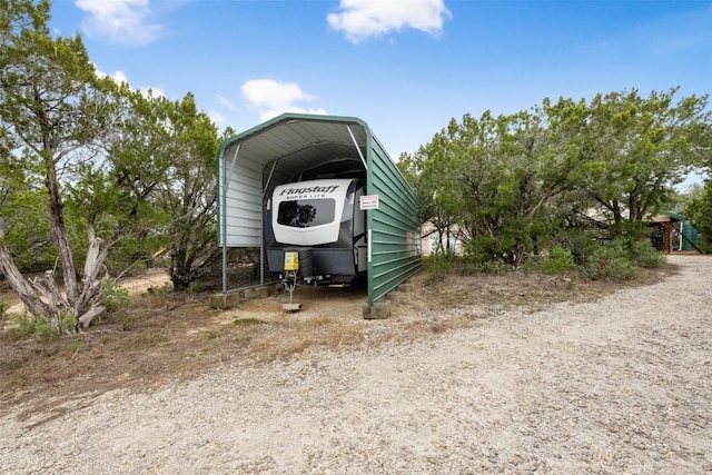 view of outbuilding with a carport