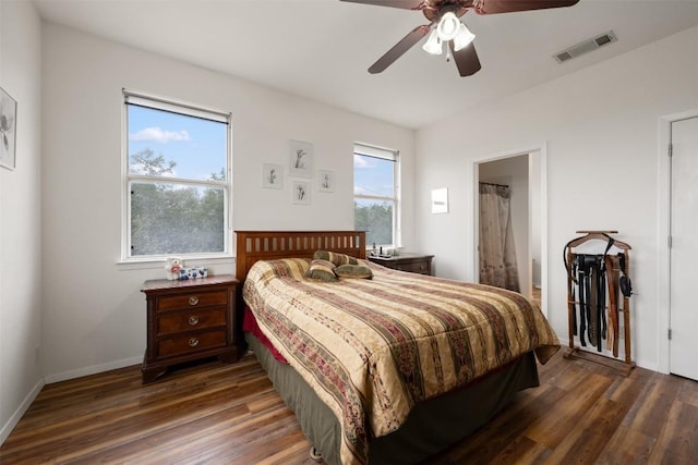 bedroom featuring dark hardwood / wood-style flooring and ceiling fan