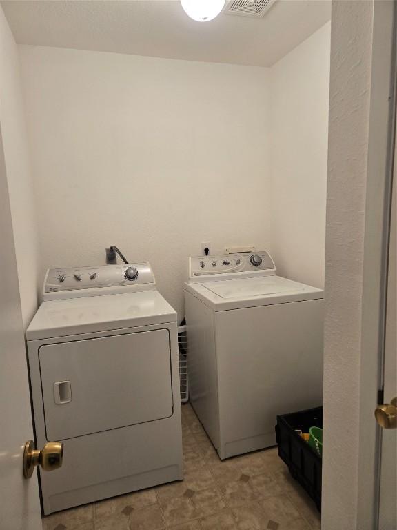 15101 Foy Dr, Austin, TX 78734 - washroom featuring washing machine and clothes dryer