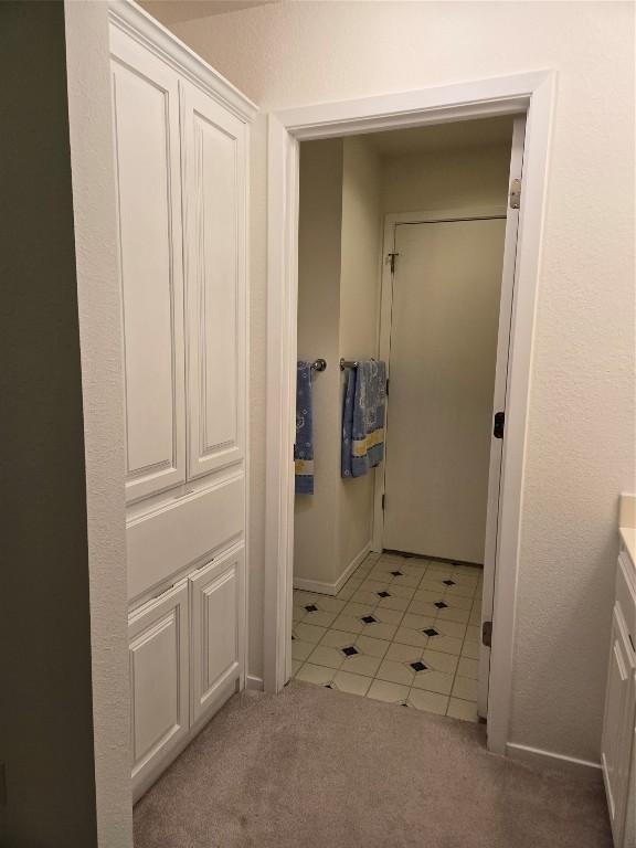 bathroom with tile patterned floors and vanity