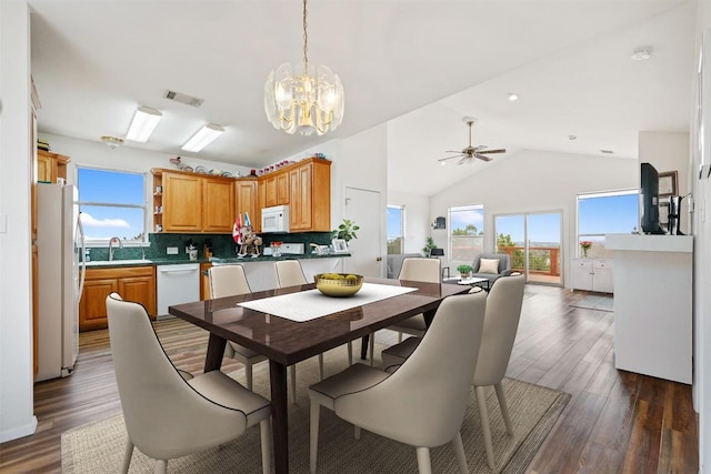 15101 Foy Dr, Austin, TX 78734 - dining space featuring a chandelier, lofted ceiling, plenty of natural light, a ceiling fan, and dark wood-style flooring