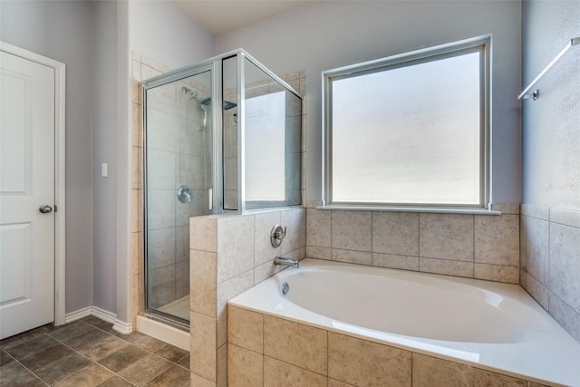 bathroom featuring separate shower and tub