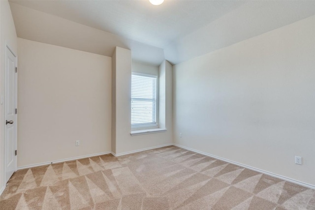 unfurnished room with light colored carpet