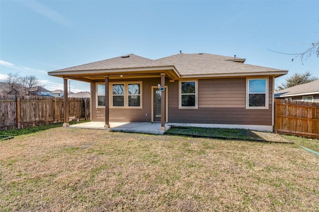 rear view of property with a patio area and a lawn