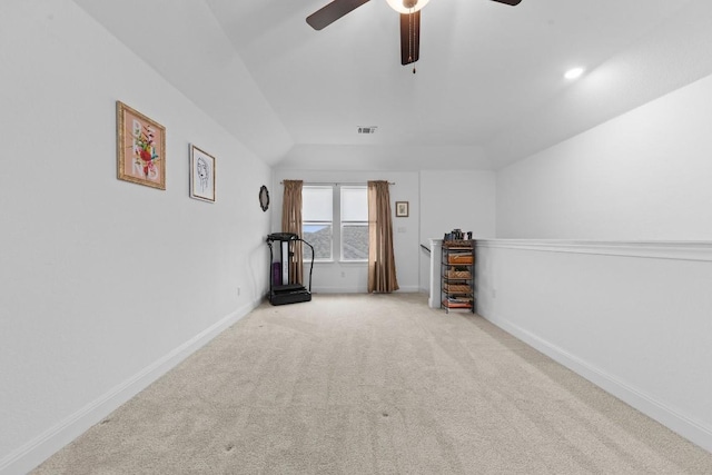 additional living space with lofted ceiling, light colored carpet, and ceiling fan