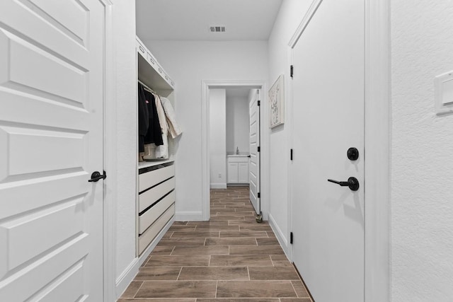 125 Jasmine Ln, Marble Falls, TX 78654 - hallway featuring wood tiled floors and baseboards