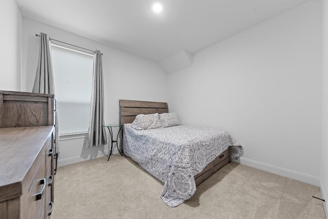 bedroom with light colored carpet