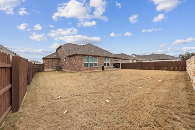 rear view of property featuring central AC