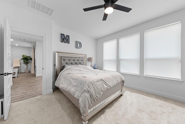 carpeted bedroom with ceiling fan