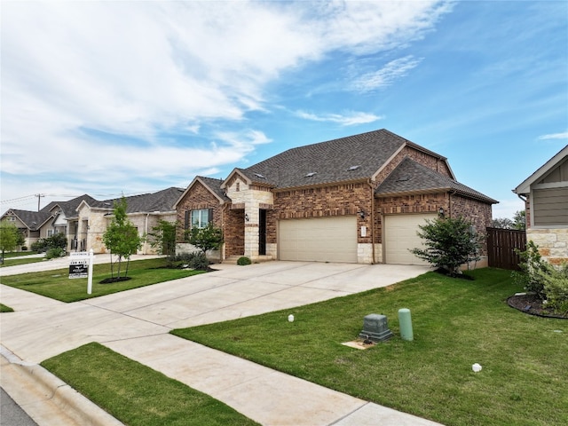 125 Jasmine Ln, Marble Falls, TX 78654 - french country inspired facade with driveway, an attached garage, a front lawn, and brick siding