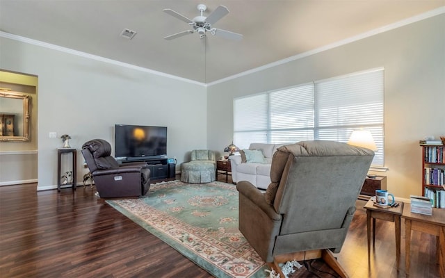 living room with crown molding, ceiling fan, and dark wood-type flooring