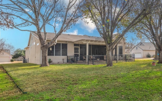 back of property with central AC, a yard, a sunroom, and a garage