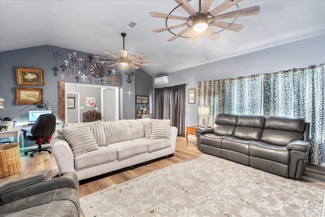 living room featuring vaulted ceiling, a wall mounted air conditioner, ceiling fan, and light hardwood / wood-style flooring