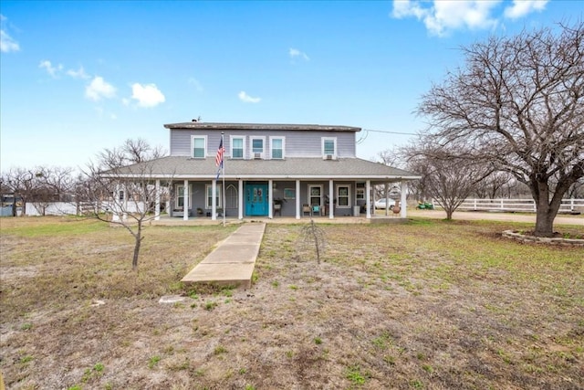 farmhouse inspired home featuring a front lawn and a porch