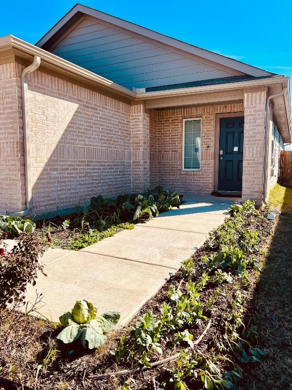 13120 Roving Pass, Elgin, TX 78621 - entrance to property with brick siding