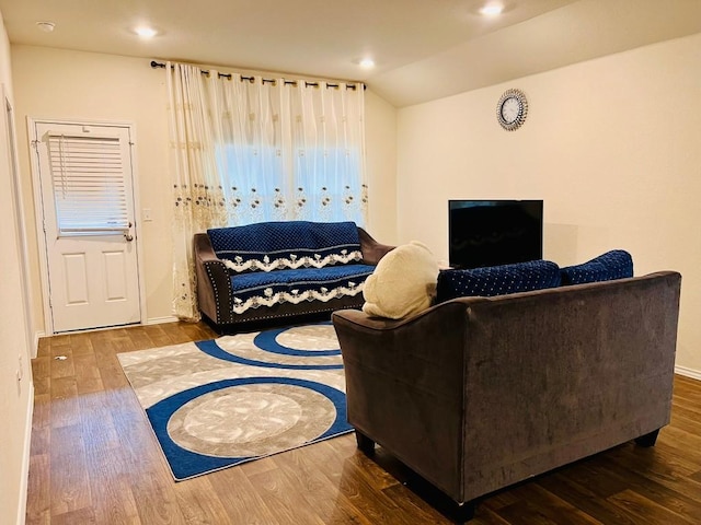 13120 Roving Pass, Elgin, TX 78621 - living room featuring wood finished floors, lofted ceiling, recessed lighting, and baseboards