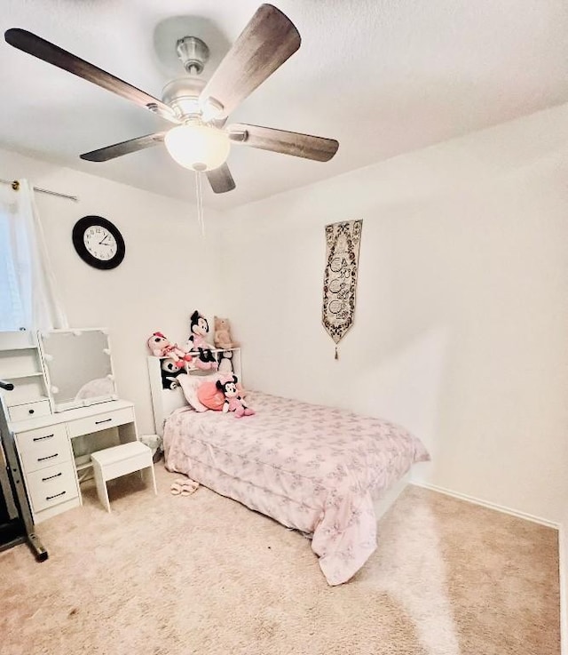 bedroom with ceiling fan and light colored carpet