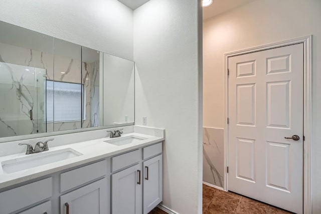 bathroom with vanity and a shower