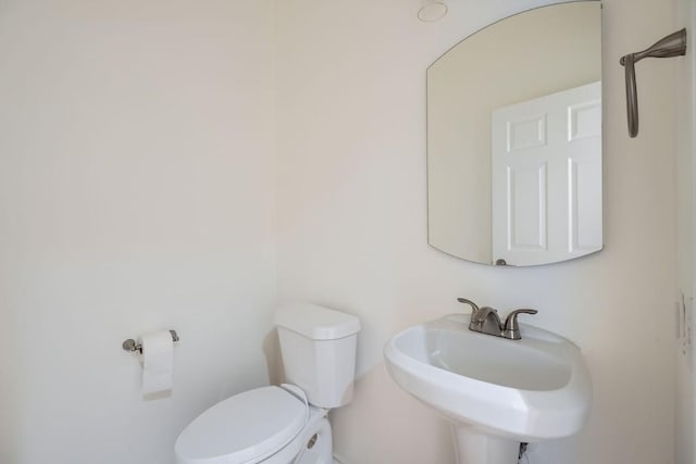 bathroom with sink and toilet