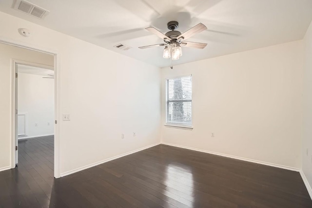 empty room featuring dark hardwood / wood-style floors and ceiling fan