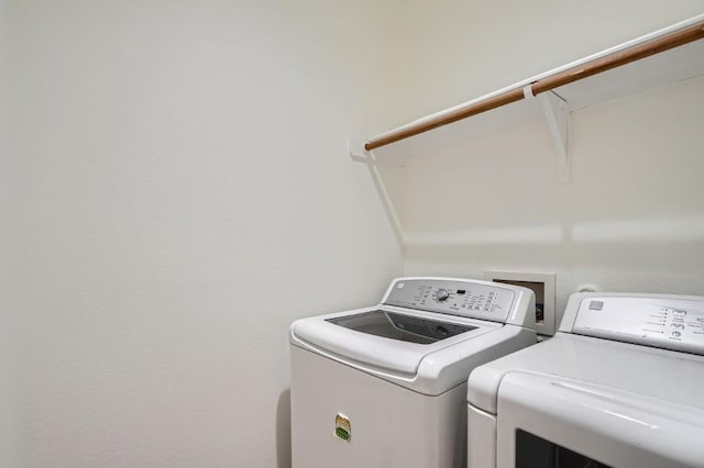 washroom with washer and clothes dryer