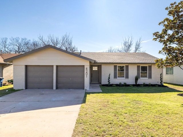 single story home with a garage and a front lawn