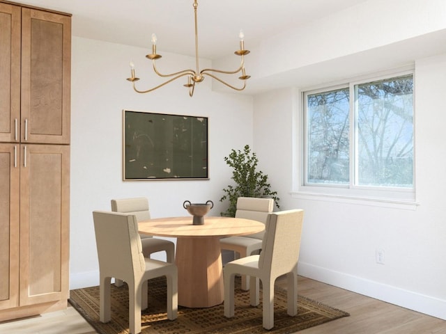 dining space with wood-type flooring and a chandelier