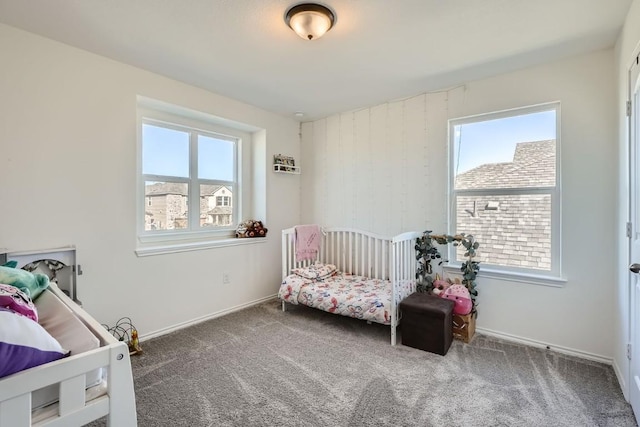 bedroom with multiple windows and carpet