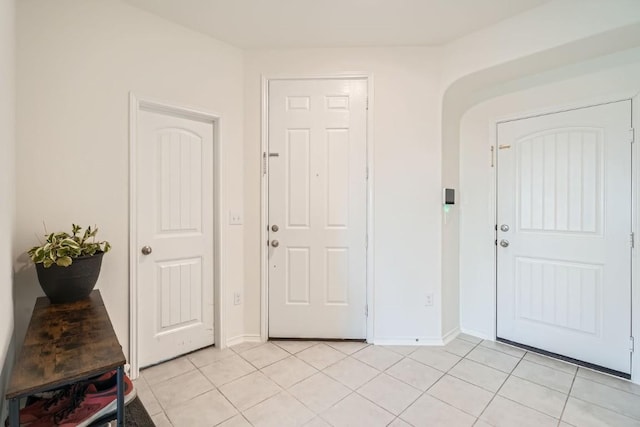 entrance foyer featuring light tile patterned floors